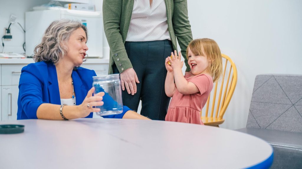 Dr. Esther Leerkes works with a young child for iGrow