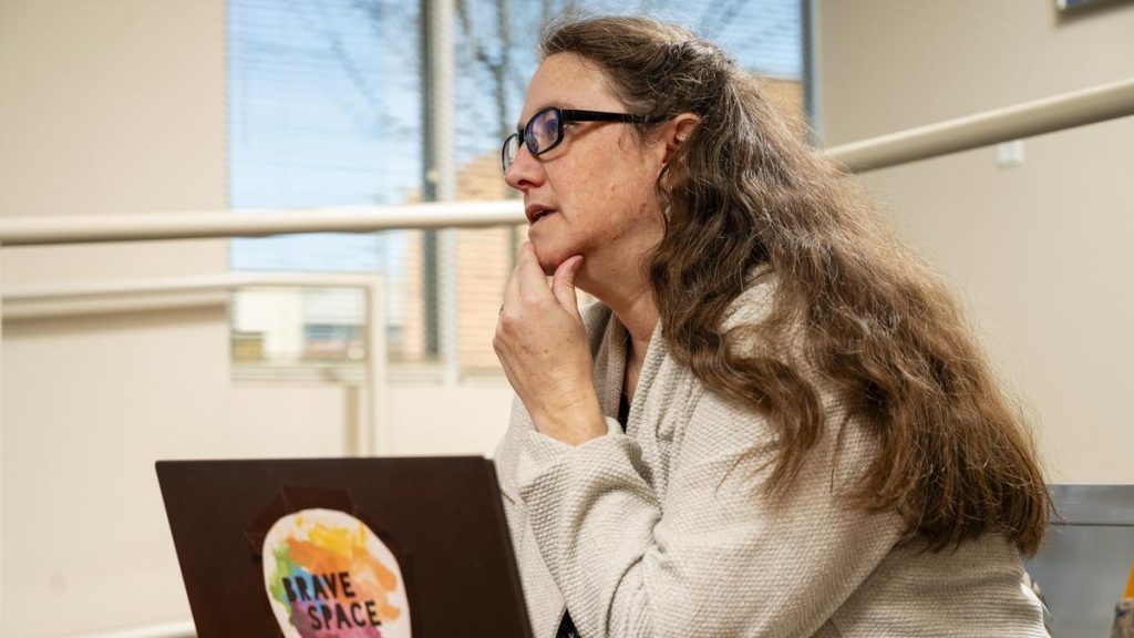 UNCG researcher Willow Burgess-Johnson focuses on a conversation