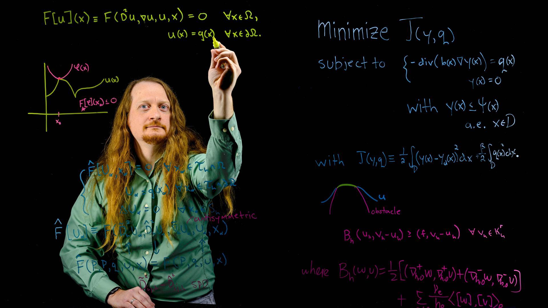 UNCG's Dr. Tom Little works on a mathematical formula